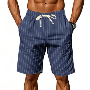 Detailed view of men's loose blue striped linen shorts with white adjustable drawstring waist