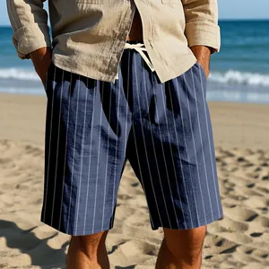 Detailed view of men's blue striped linen beach shorts with drawstring waist on model