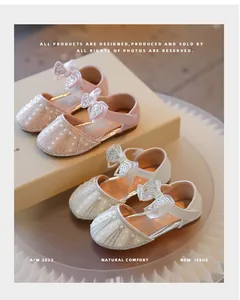 Elegant girl's princess shoes featuring sparkling rhinestone bows and delicate pearl details