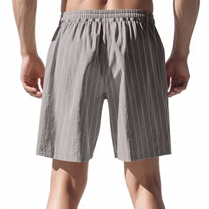Rear view of men's casual grey vertical striped linen shorts for summer beach wear