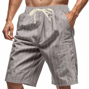 Detailed view of men's grey linen shorts featuring white pinstripes and a cream drawstring