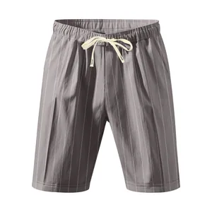 Detail view of men's breathable linen shorts with vertical stripes and drawstring.