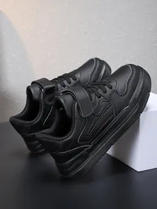 Detailed side profile of sleek black all-match boys' school performance sports sneakers
