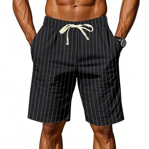 Close-up detail of men's black pinstripe linen shorts featuring a white drawstring waist
