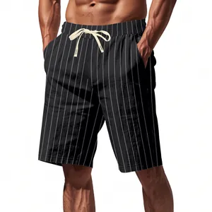 Detail view of men's black striped linen shorts featuring a white drawstring and relaxed fit
