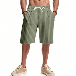 Detail showing green striped linen shorts with white drawstring and elastic waist.
