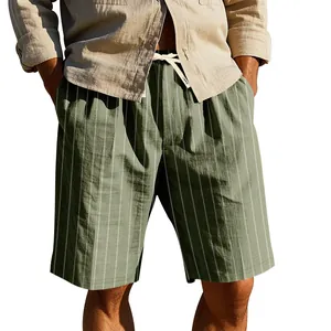 Detailed view of men's green and white vertical striped linen shorts with drawstring