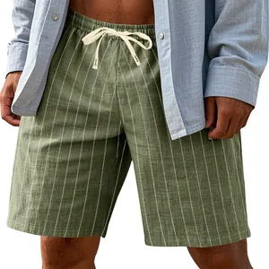 Close-up detail of olive green vertical stripe linen shorts with drawstring waist.