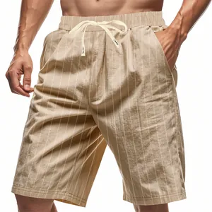 Detail of men's beige linen shorts featuring vertical stripes and drawstring waist