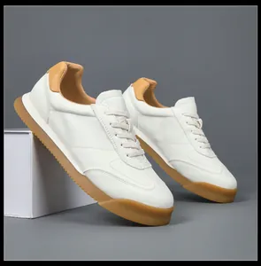 Detailed view of men's white genuine leather GAT sneakers with classic gum sole.