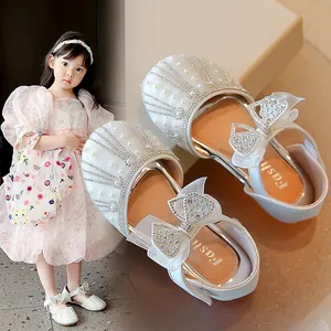 Elegant white girls' princess shoes featuring pearls, rhinestones, and mesh bows.