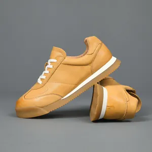 Premium men's tan leather GAT sneakers with soft gum sole, leisure style for summer.