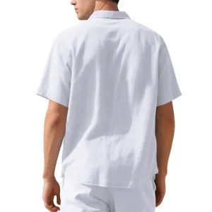Back view detail of a men's white woven short-sleeved casual linen shirt in a loose fit