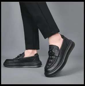 Close-up view of stylish black perforated leather loafers for men with durable soles