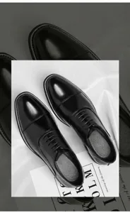 Detail of classic black cap-toe Oxford shoes for business formal wear