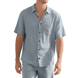 Detail view of mens light blue short sleeve woven summer shirt with front chest pocket