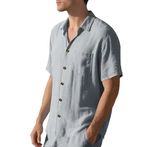 Side detail view of men's light grey casual short-sleeve shirt with woven texture