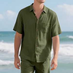 Casual men's olive green short sleeve shirt and shorts set shown in a beach setting
