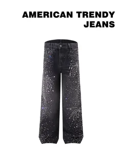 Macro view of sparkly fireworks rhinestone pattern on black straight leg denim jeans