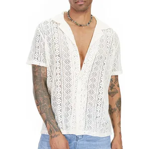Detailed view of men's white hollow-out lace shirt featuring intricate patterns on model