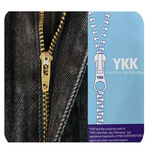 Close-up detail showing the durable YKK brass metal zipper on mens black denim pants