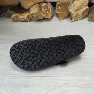 Macro detail view showing the durable black anti-slip sole of the purple suede clog mule