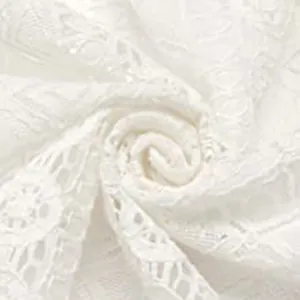 Detailed macro view of white hollow-out floral lace material for men's trendy summer shirts