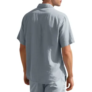 Back view of men's casual woven short-sleeve shirt in misty blue showing fine fabric texture