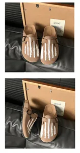 Suede brown platform mules featuring a decorative white skeleton hand embroidery