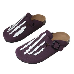 Purple suede clogs featuring white skeleton hand bone applique with a thick platform sole