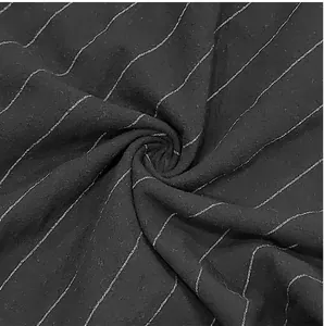 Detailed macro view showing the texture of black and white striped breathable linen fabric