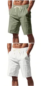 Detail view of men's linen striped shorts with drawstring waist in green and white colors
