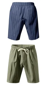 Close-up view of navy and olive green striped linen shorts featuring a drawstring waist