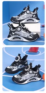 Boys breathable sports sneakers with mechanical knob buckle in black and white.