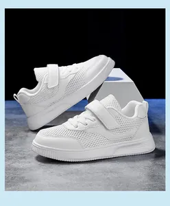 Macro detail of children's breathable white mesh sport shoes with velcro strap
