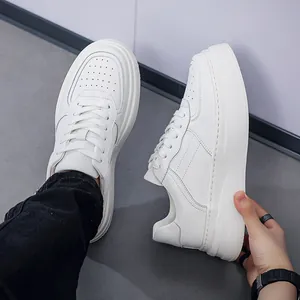 Close-up detail of premium white leather platform sneakers with breathable perforated toe