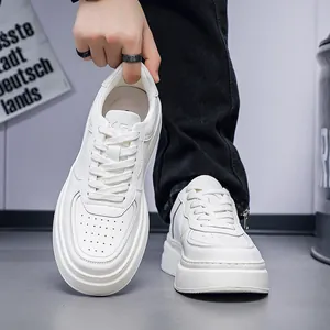 Detailed view of premium white leather breathable casual sneakers with platform soles.