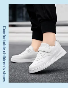 Detailed side view of white breathable children's sneakers with hook and loop straps.