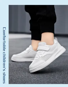 Detailed view of breathable white mesh sneakers for kids featuring hook-and-loop straps