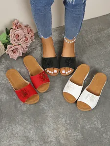 Stylish women's wedge floral slides in red white and black with elegant open toe design