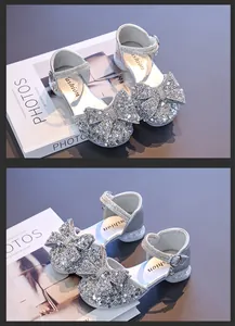 Sparkling silver girl's princess sandals featuring a sequined rhinestone bow detail.