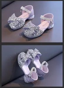 Side and top views of elegant purple girls sandals featuring glittery rhinestone bow detail