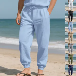 Loose linen beach joggers for men available in multiple colors with elastic cuffs.