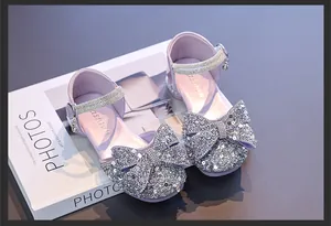 Sparkly purple princess shoes for girls featuring sequins and a delicate bow detail