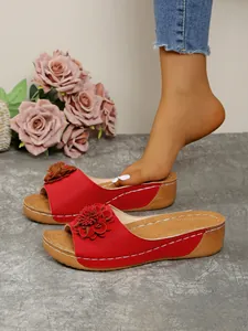 Red wedge sandals with decorative flowers and comfortable peep toe wedge heel for women