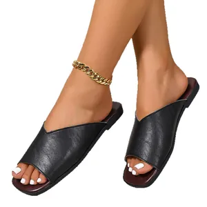 Elegant black V-cut leather flat slides for women with a chic square open toe design.