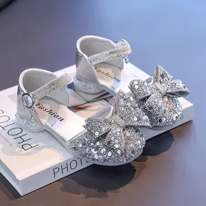 Sparkling silver girls' princess sandals with rhinestone bow and sequined details