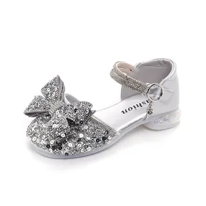 Sparkling silver girl's princess sandals with a large sequined bow and rhinestones