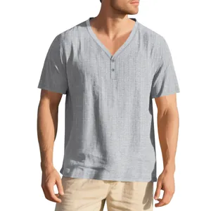 Close-up of the slub texture and V-neck button detail on a men's grey Henley shirt