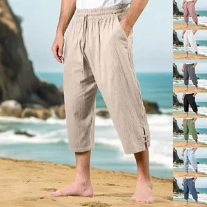 Lightweight men's cotton linen beach pants showing multiple color variants in seaside setting